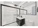Modern bathroom with sleek fixtures, a tiled shower, and contemporary vanity at 7930 Jeffery Ave, North Port, FL 34287