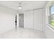 Bright bedroom showcasing a large closet and lots of light at 7930 Jeffery Ave, North Port, FL 34287
