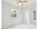 Bright bedroom showcasing neutral tones and a view of the neighborhood at 7930 Jeffery Ave, North Port, FL 34287
