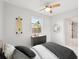 Bright bedroom featuring modern decor and a view of the neighborhood at 7930 Jeffery Ave, North Port, FL 34287