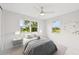 Bright bedroom with two large windows and contemporary decor at 7930 Jeffery Ave, North Port, FL 34287