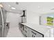 Modern kitchen with a large marble island and state-of-the-art appliances at 7930 Jeffery Ave, North Port, FL 34287