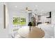 Stylish kitchen boasts modern appliances, gray cabinets, and a bright breakfast nook with backyard view at 7930 Jeffery Ave, North Port, FL 34287