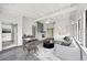 Staged living room with vaulted ceiling, fireplace, modern furnishings and decor at 7930 Jeffery Ave, North Port, FL 34287