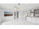Open concept living space with marble floors, modern kitchen, and lots of natural light at 7930 Jeffery Ave, North Port, FL 34287