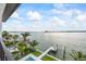 Beautiful aerial view of the waterfront property, showcasing the pool, dock, and lush landscaping at 820 Bay Point Dr, Madeira Beach, FL 33708