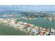 Aerial view of waterfront neighborhood with private docks, beautiful landscaping, and gorgeous water views at 820 Bay Point Dr, Madeira Beach, FL 33708
