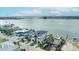 Desirable waterfront property with a stunning exterior, lush greenery, and a picturesque view at 820 Bay Point Dr, Madeira Beach, FL 33708
