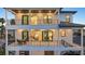 Multiple stories of covered balconies featuring outdoor seating and stunning views at 820 Bay Point Dr, Madeira Beach, FL 33708