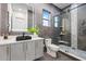 Modern bathroom featuring gray tile, glass shower with a bench, and a vessel sink vanity at 820 Bay Point Dr, Madeira Beach, FL 33708