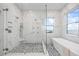 Elegant bathroom with large glass shower and modern fixtures at 820 Bay Point Dr, Madeira Beach, FL 33708