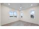 Bedroom featuring recessed lighting, wood floors, three double-hung windows, and neutral paint at 820 Bay Point Dr, Madeira Beach, FL 33708