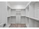 Spacious walk-in closet with custom shelving and drawers for optimal storage and organization at 820 Bay Point Dr, Madeira Beach, FL 33708