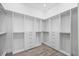 Walk-in closet with custom shelving and drawer units at 820 Bay Point Dr, Madeira Beach, FL 33708