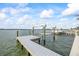 The sturdy dock offers water access, along with a boat lift to keep your boat secure and ready at 820 Bay Point Dr, Madeira Beach, FL 33708
