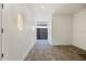 Hallway with tile flooring and modern light fixture at 820 Bay Point Dr, Madeira Beach, FL 33708