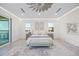 Well-lit main bedroom featuring neutral color palette, recessed lights, ceiling fan, and water view at 820 Bay Point Dr, Madeira Beach, FL 33708