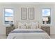 Bright, airy main bedroom featuring a ceiling fan, stylish lighting, neutral paint and great view of water at 820 Bay Point Dr, Madeira Beach, FL 33708