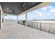 Inviting covered patio offering ample space, ceiling fans, and stunning waterfront views at 820 Bay Point Dr, Madeira Beach, FL 33708