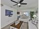 Bright living room with neutral tones, stylish decor, and view of the dining area at 9508 Tocobaga Pl, Riverview, FL 33578