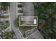 An overhead view of the property highlighting the roof and surrounding trees and neighborhood at 9616 Carlsdale Dr, Riverview, FL 33578