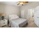 Cozy bedroom with a ceiling fan, neutral decor, and ample closet space, offering a peaceful retreat at 9616 Carlsdale Dr, Riverview, FL 33578