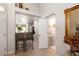 Welcoming foyer with tiled floors, wet bar, and half bathroom at 9616 Carlsdale Dr, Riverview, FL 33578