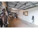 Spacious garage with ample storage shelving and a convenient pedestrian door at 9616 Carlsdale Dr, Riverview, FL 33578