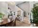 Inviting living room featuring high ceilings, a staircase, and abundant natural light, perfect for gatherings and relaxation at 9616 Carlsdale Dr, Riverview, FL 33578