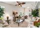Cozy living room featuring a ceiling fan, lots of natural light, and decorative accents at 9616 Carlsdale Dr, Riverview, FL 33578