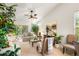 Comfortable living room with natural lighting, ceiling fan, and access to the patio at 9616 Carlsdale Dr, Riverview, FL 33578
