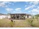 Backyard featuring a covered patio and plenty of space for outdoor activities at 2816 Soprano Ln, North Port, FL 34286