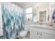 Guest bathroom features a sink vanity, toilet, and shower with tub at 2816 Soprano Ln, North Port, FL 34286