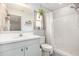 Ensuite bathroom features a single sink vanity and a walk-in shower at 2816 Soprano Ln, North Port, FL 34286