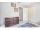 Neutral bedroom with a dresser and closet doors, offering ample storage at 2816 Soprano Ln, North Port, FL 34286