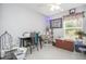 Spare bedroom features an overhead light, window, and plenty of space for an office at 2816 Soprano Ln, North Port, FL 34286