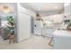 Bright kitchen features white cabinetry and appliances; open floor plan to the living areas at 2816 Soprano Ln, North Port, FL 34286