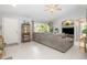 Cozy living room with a large window, an oversized sectional couch, and stylish decor at 2816 Soprano Ln, North Port, FL 34286