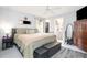 Spacious main bedroom features a ceiling fan, closet, and ensuite bathroom at 2816 Soprano Ln, North Port, FL 34286