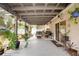 Inviting covered patio with lush greenery, ideal for relaxation and outdoor living at 2816 Soprano Ln, North Port, FL 34286
