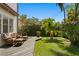 Beautiful backyard offering a private retreat with lush greenery and comfortable outdoor furniture at 3118 W Bay Villa Ave, Tampa, FL 33611