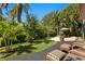 Relaxing backyard with chairs, a patio, and lush landscaping for outdoor enjoyment at 3118 W Bay Villa Ave, Tampa, FL 33611