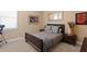 Bedroom features neutral paint, carpet, and a window with shutters at 3118 W Bay Villa Ave, Tampa, FL 33611