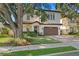 Charming two-story home featuring lush landscaping and a well-manicured lawn at 3118 W Bay Villa Ave, Tampa, FL 33611