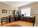 Bright office with wooden floors, large window, desk, and storage at 3118 W Bay Villa Ave, Tampa, FL 33611