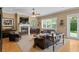 Inviting living room with a fireplace, comfortable seating, hardwood floors, and ample natural light at 3118 W Bay Villa Ave, Tampa, FL 33611