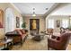 Elegant living room features arched windows, plantation shutters, and sophisticated furnishings at 3118 W Bay Villa Ave, Tampa, FL 33611