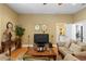 Inviting living room with hardwood floors, neutral walls, and comfortable seating arrangement at 3118 W Bay Villa Ave, Tampa, FL 33611