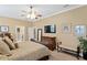 Spacious main bedroom features a ceiling fan and decorative furniture at 3118 W Bay Villa Ave, Tampa, FL 33611