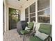 Cozy screened patio with comfortable seating, ideal for enjoying the outdoors bug-free at 3118 W Bay Villa Ave, Tampa, FL 33611